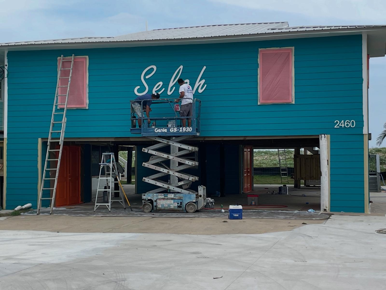 Our crew painting a beach house exterior